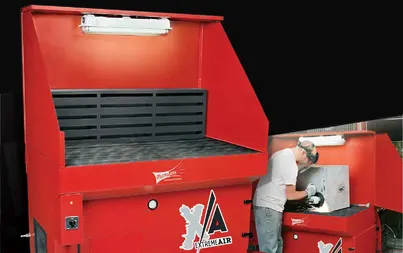 A man working on a downdraft table.